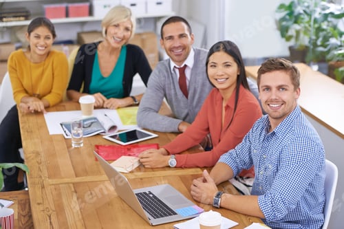 Preview: Weve be expecting you. Portrait of a group of colleagues sitting around a table.