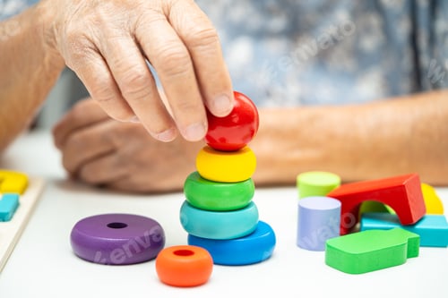 Preview: Alzheimer disease AD, Asian elderly woman patient suffering from dementia learn practical.
