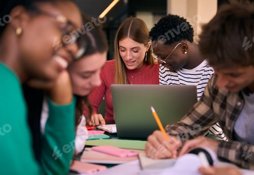 Preview: Selective focus on multiracial couple of concentrated students doing homework