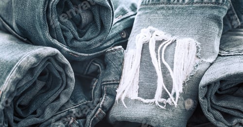 Preview: jeans on a wooden background