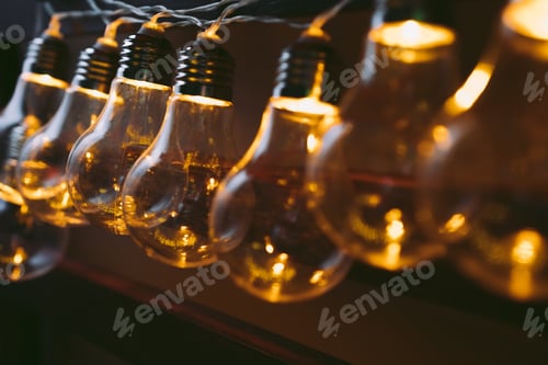 Preview: Garland of light bulb lamps in the dark