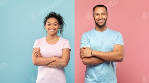 Preview: Portrait of happy black couple standing with folded arms, looking and smiling at camera over blue