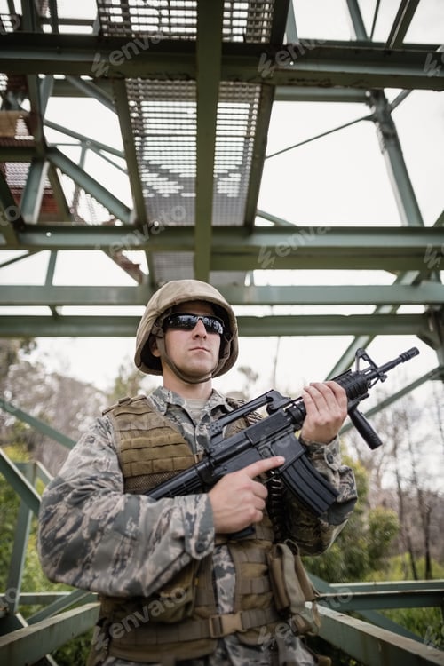 Preview: Military soldier guarding with a rifle