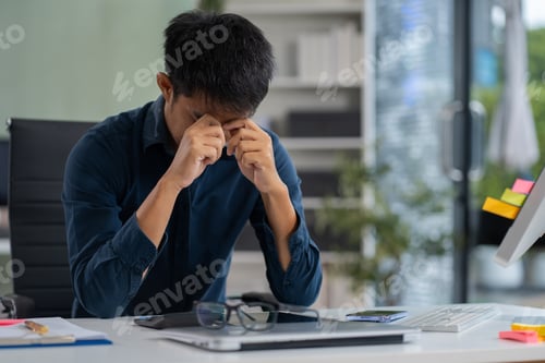 Preview: stressed asian businessman working in the office. Businessman thinking too much work concept.