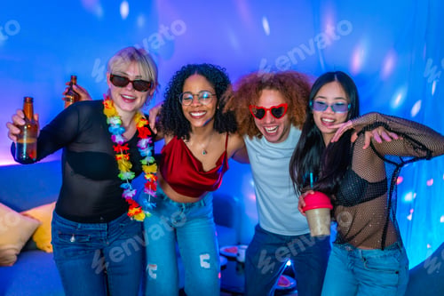 Preview: Friends enjoying drinks and music at home party