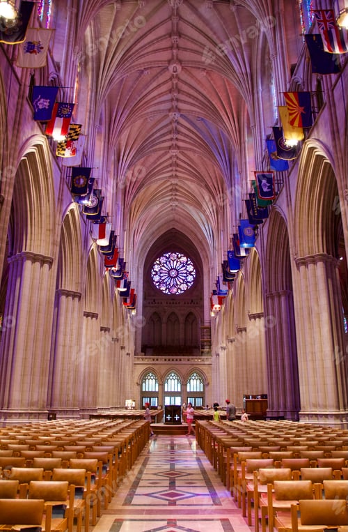 Preview: Looking down rows of empty chairs toward the pulpit of a nearly empty cathedral