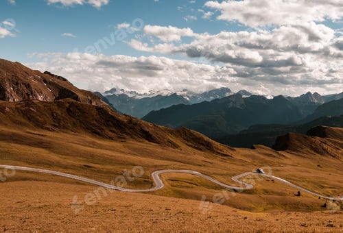 Preview: Aerial view of empty scenic road on a mountain pass in italian dolomites.