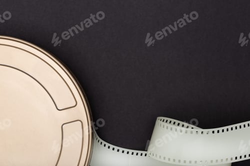 Preview: Motion Picture Film Can and film strip on black background