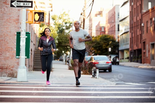 Preview: Young black couple jogging in Brooklyn street