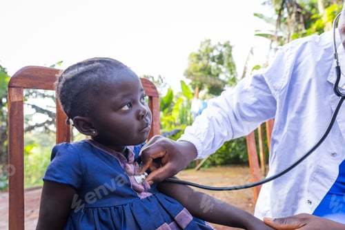 Preview: A doctor listens to a little girl's heartbeat with a stethoscope in Africa