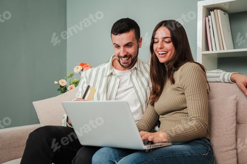 Preview: Smiling Couple Shopping Online with Credit Card