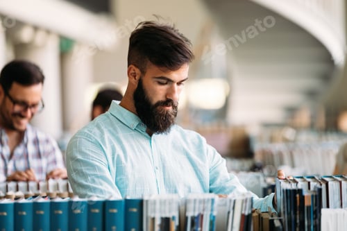 Preview: Portrait of young male student in library