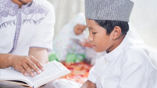 Preview: Asian Muslim families read the quran after prayers