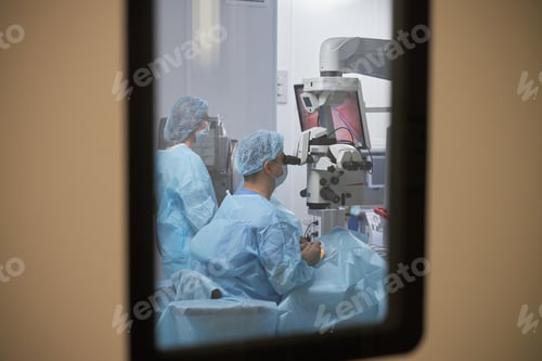 Preview: Middle Aged Woman Performing Surgery with Woman