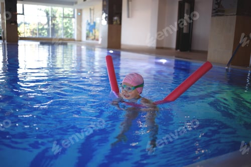 Preview: little girl doing exercises in the pool