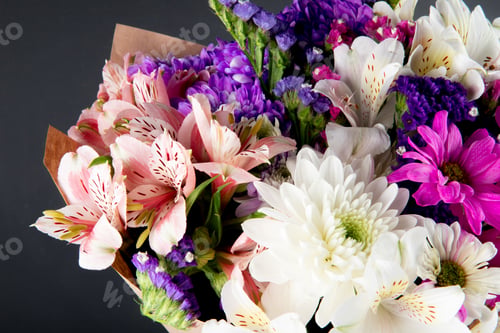 Preview: side view of a bouquet of pink white and purple color statice alstroemeria