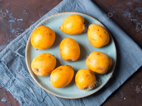 Preview: Loquat Japanese medlar fruit on dark background