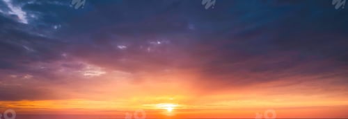 Preview: Beautiful vibrant sunset sky shining over horizon during golden hour