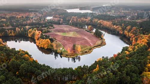 Preview: Curvy river and autumn forest. Aerial view of nature, Poland