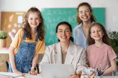 Preview: Happy kids and teacher at school