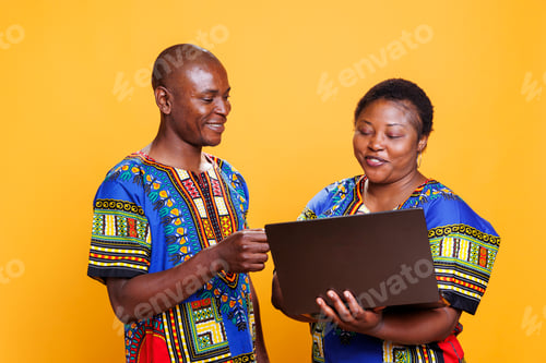 Preview: Couple using laptop for online purchase