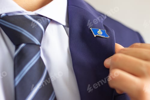 Preview: Person wearing kansas flag pin on suit lapel