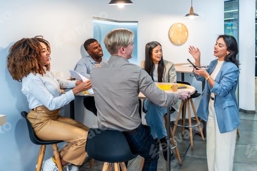 Preview: Diverse team collaborating on project in coworking office space