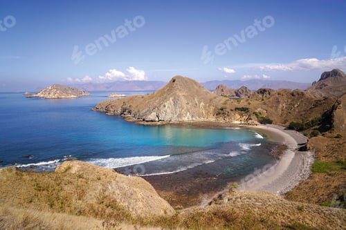 Preview: Padar Island with scenic high view of bay beach surrounded by a wide ocean and part of komodo
