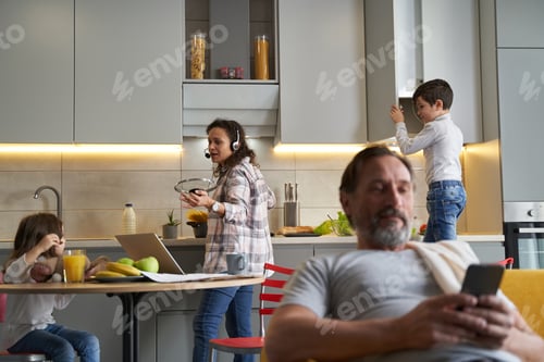 Preview: Woman cooking macaroni while talking to her daughter