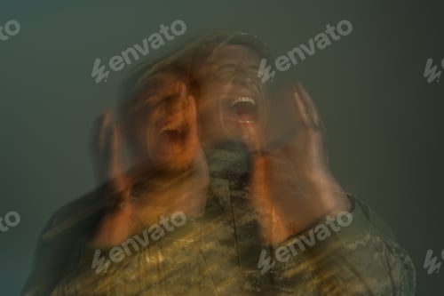 Preview: long exposure of soldier suffering from post traumatic stress disorder and screaming isolated