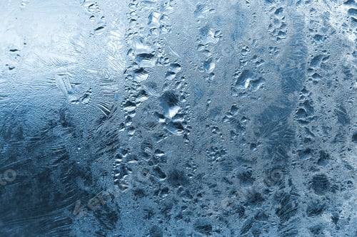 Preview: Frozen water drops and ice pattern on glass