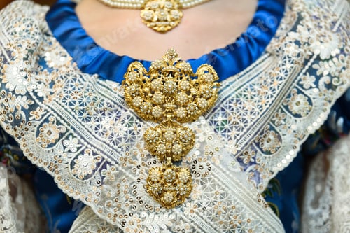 Preview: Traditional style gold jewelery on the chest of a woman with traditional fallas costume in Valencia.