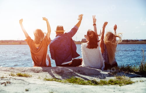 Preview: Group of friends having fun at the beach on sunny day