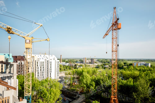 Preview: Construction site with building cranes