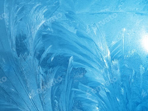 Preview: Beautiful ice pattern and sunlight closeup on winter window