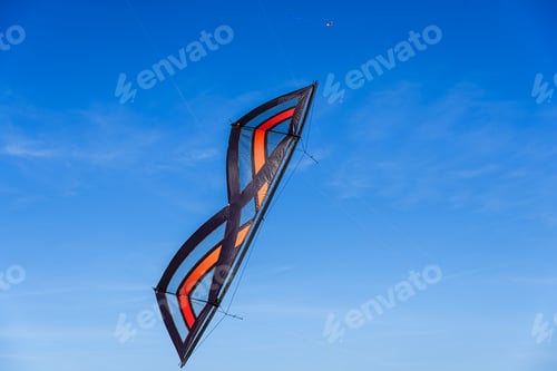 Preview: Acrobatic Stunt kite flying in the blue sky.