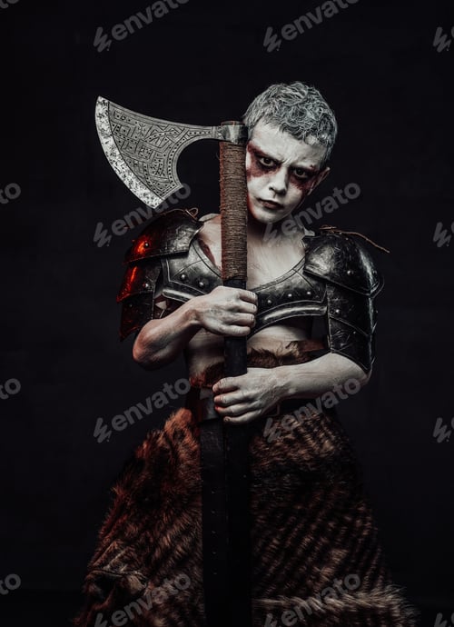 Preview: Holding an axe little barbarian with painted skin in dark background