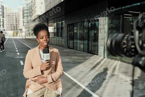 Preview: News reporter outdoors