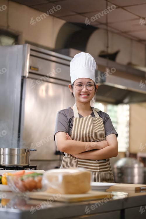 Preview: Culinary student in training kitchen with fresh ingredients ready for cooking practice