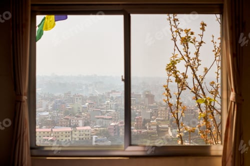 Preview: View of Kathmandu from hotel window through urban haze with lot of low rise buildings
