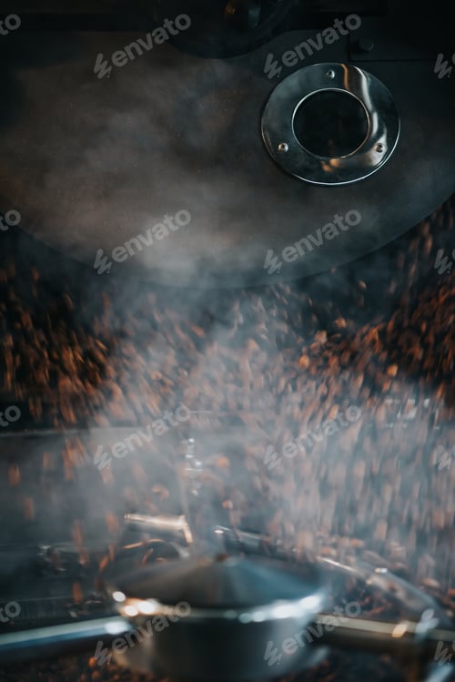 Preview: Steaming hot coffee beans during roasting process in professional machine