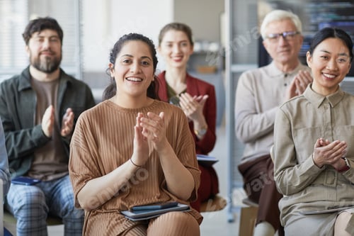 Preview: Diverse Group of People Applauding at Seminar