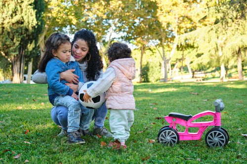 Preview: Dominican mother teaching her kids to share the soccer ball.