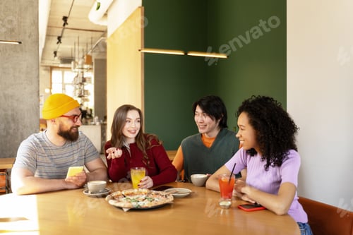 Preview: Friends Enjoying Drinks and Pizza Together