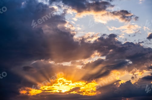 Preview: Dramatic sunset sky, light from heaven. Cumulus stormy clouds in summer