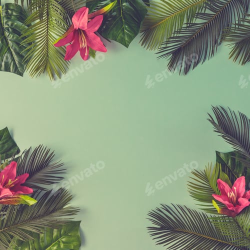 Preview: Creative nature layout made of tropical leaves and flowers on sky blue background. Flat lay.
