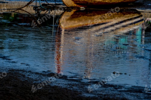 Preview: Reflection of a fishing boat during low tide