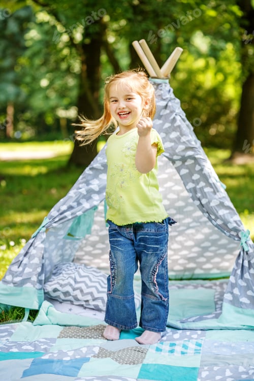 Preview: A preschooler dancing in the park. Summer. Concept of lifestyle,