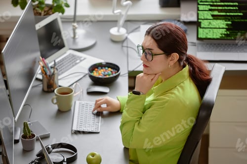Preview: IT Developer Writing Code at Programmer Desk Setup