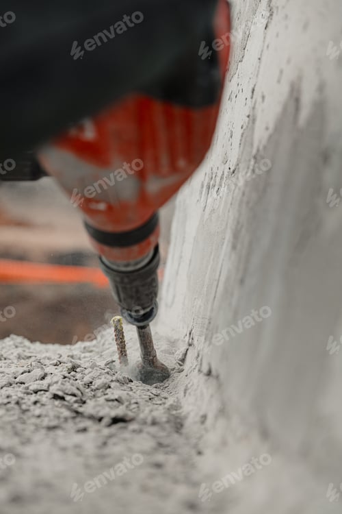 Preview: Close-up shot of a demolition hammer, power drill concrete in action